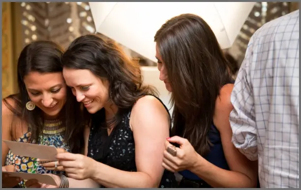 Women laughing and posing at pro print photo booth